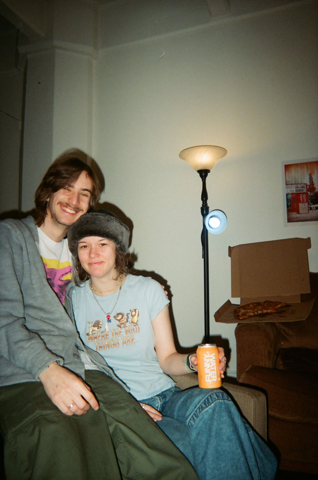 A young couple holding a can of Funny Water